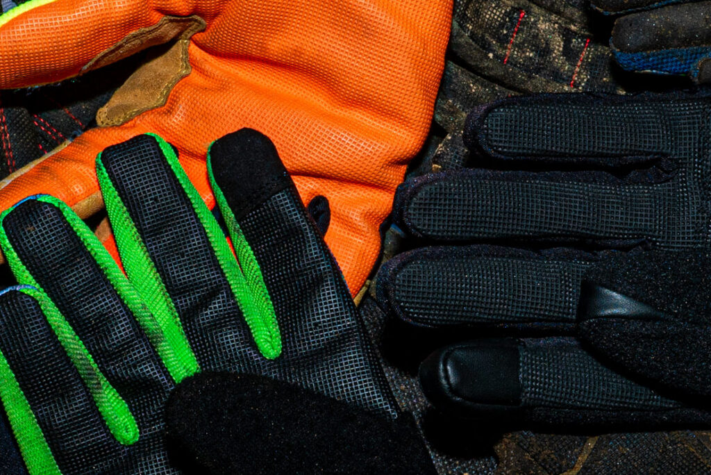 Close-up of durable safety gloves with bright colors, showcasing their texture and design.