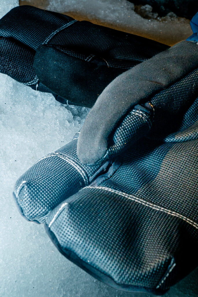 Detailed view of winter gear gloves designed for cold weather.